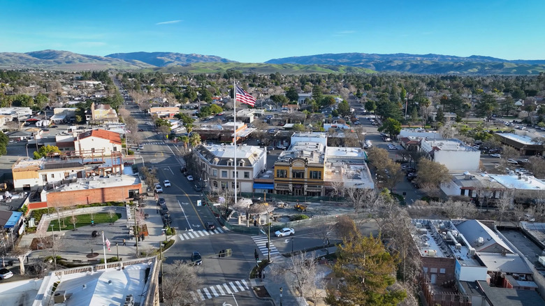 Aerial view of Livermore's downtown area with a large flag pole