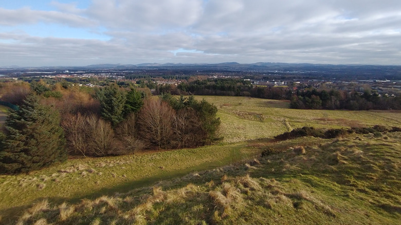 The view from a park overlooking Livingston and the surrounding area on a cloudy day in Livingston, Scotland