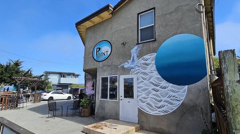 The painted concrete exterior of a neighborhood grocery store in Santa Cruz.
