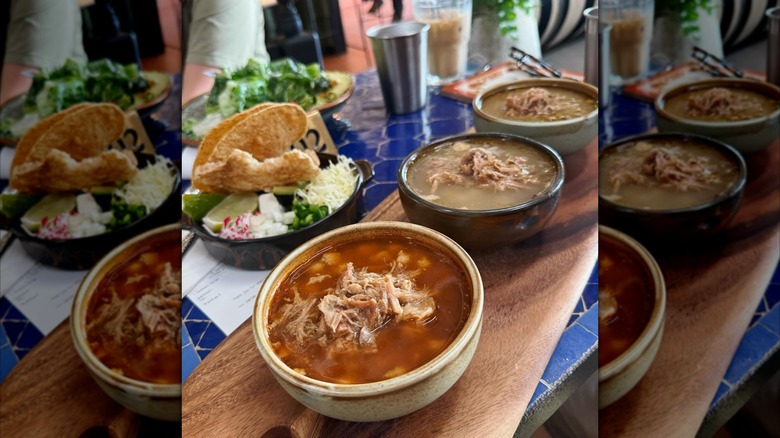 The Pozole Flight from Malena spread on a wood and tile table