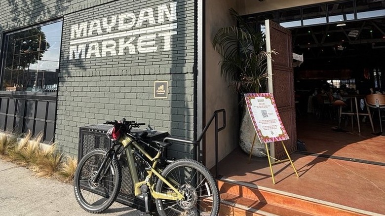 The entrance to the Maydan Market, with a bike parked in front