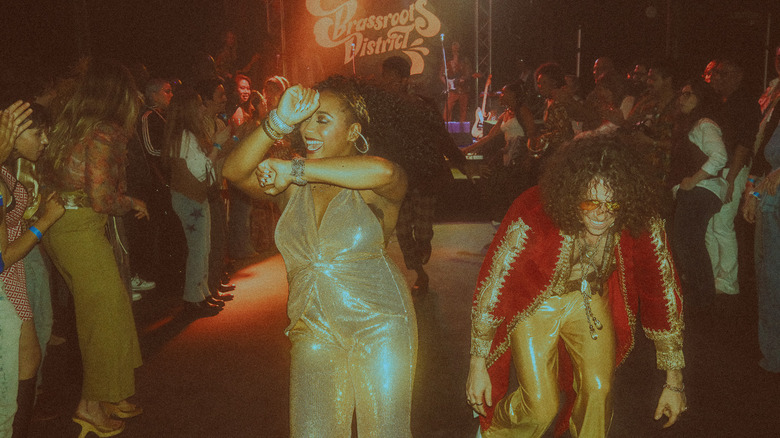 Interior image from a performance of "Brassroots District: LA '74," an immersive funk-music-centered experience playing at Catch One nightclub in Los Angeles, California.