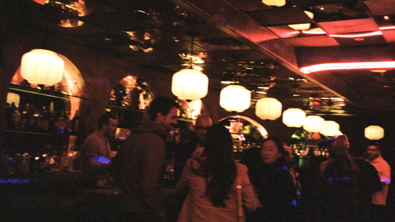 Inside The Let's Go! Disco in Los Angeles with people gathering at the bar