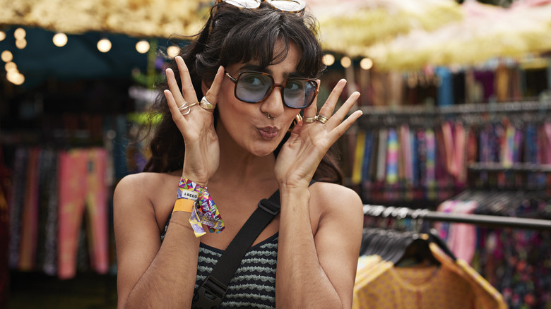 Shopper trying on a pair of sunglasses