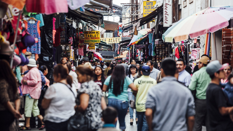 a crowded area in Santee Alley with vendors and people