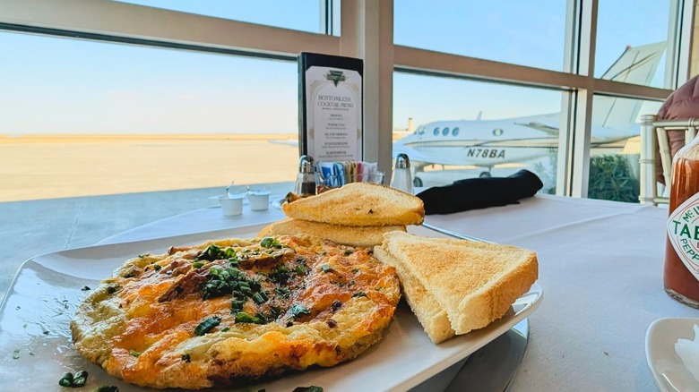 Omelet and toast overlooking the runway at Messina's Runway Café in New Orleans Lakefront Airport