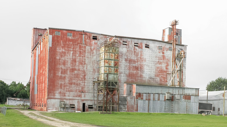 Faded red rice warehouse Crowley Louisiana