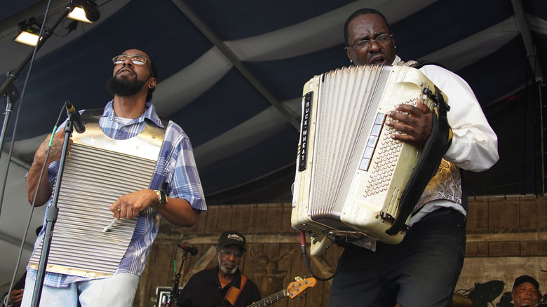 Men playing music at a Cajun festival