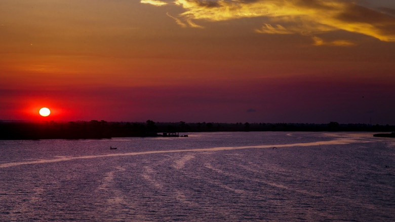 A beautiful red and yellow sunset over the water at Pass Manchac