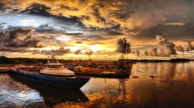 Boats docked in front of a stunning sunset