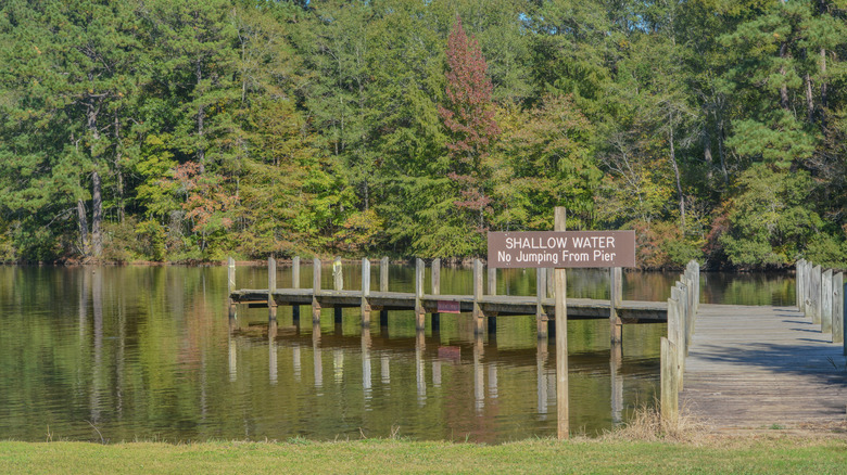 Shallow water sign and pier at Lake Claiborne