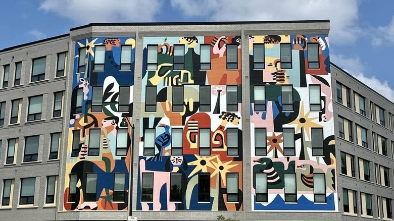 The colorful mural on the side of the Ella Apartments in Madison, Wisconsin