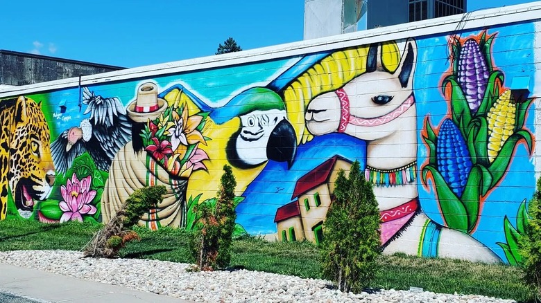 Brightly-colored mural of jungle animals at Mishqui Peruvian Cuisine in Madison, Wisconsin