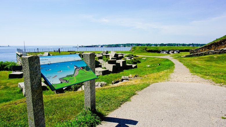 A trail near the entrance of Fort McClary State Historic Site with ocean views in the background on Kittery Point in Kittery, Maine