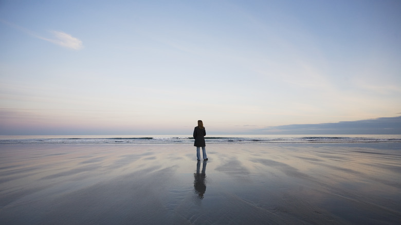 Woman on the beach in Maine