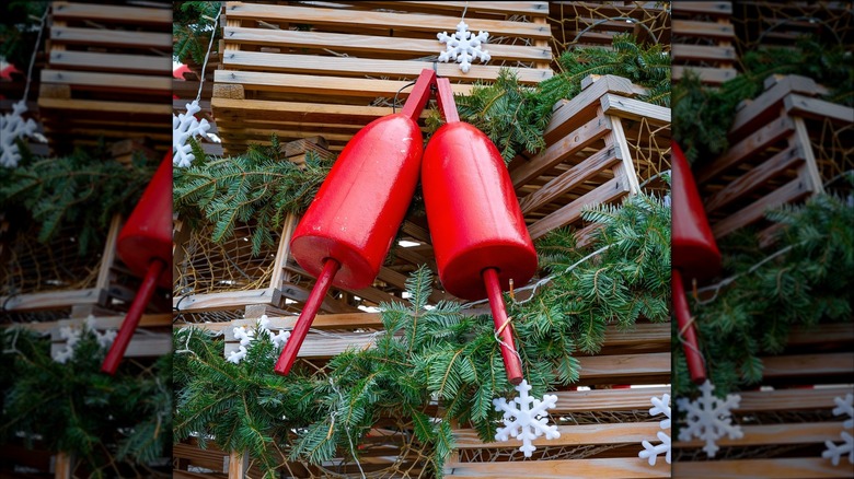 Lobster floats decorating a tree built out of wooden lobster traps in Ogunquit, ME