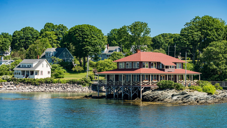 A dock house stilted over the water at Great Diamond Island, in Maine.