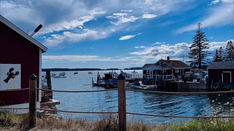 View of the bay from a lobster shack with calm water and blue skies in Thomaston