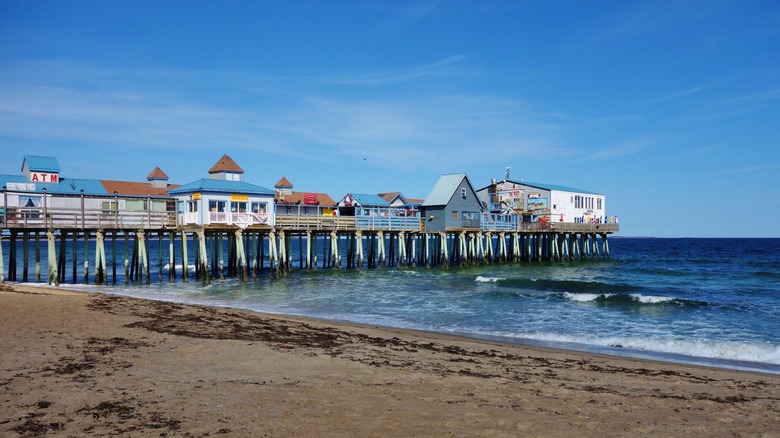 Old Orchard Beach boardwalk pier in Maine on a bluebird day