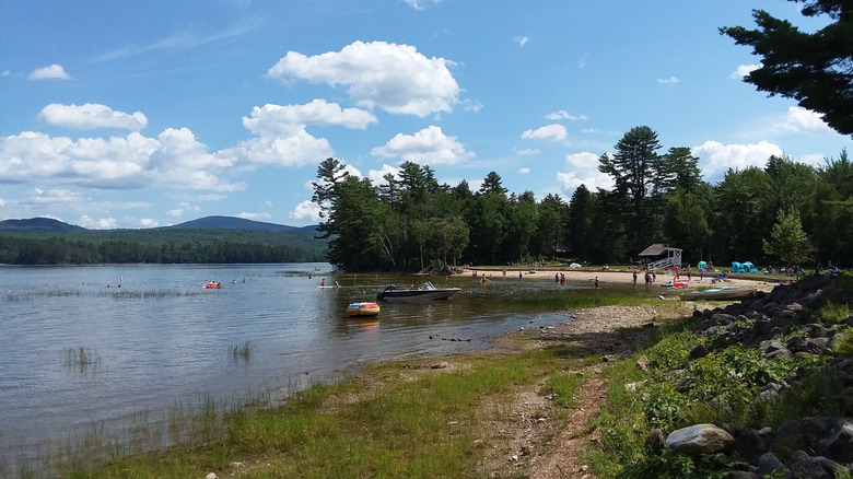 A view of sandy Webb Beach along Webb Lake in Mount Blue State Park, Maine