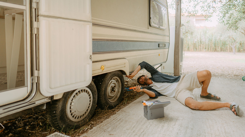 Man checking an RV