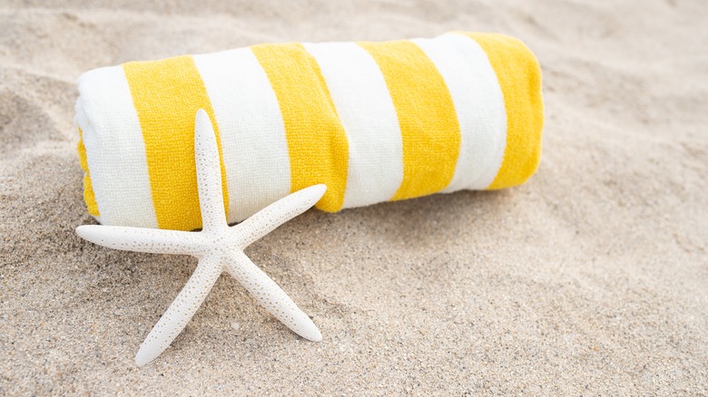 yellow white towel sand beach