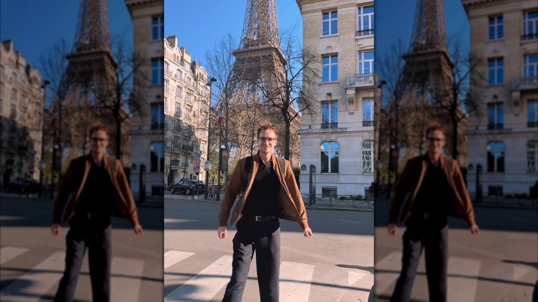 Kevin Droniak standing in front of the Eiffel Tower