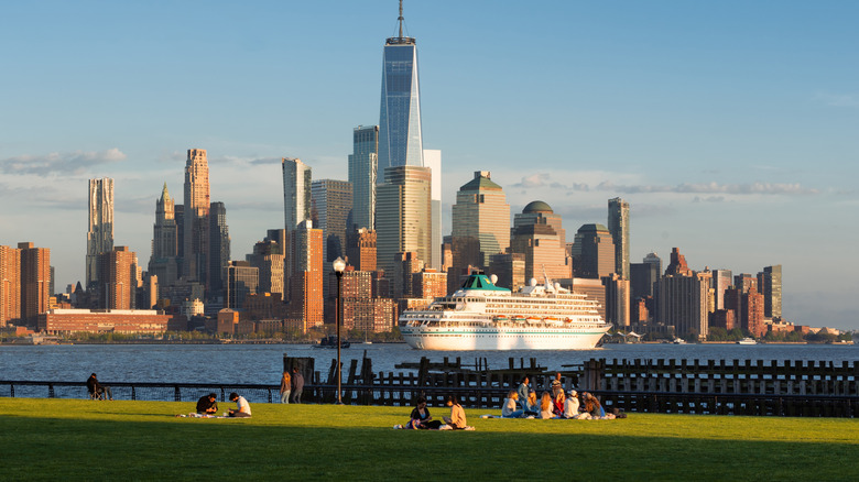 A lawn on the Hoboken waterfront with the Manhattan skyline in background