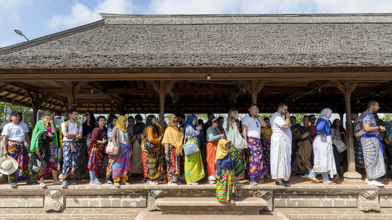 Tourists waiting in line to take a picture at the Gates of Heavi