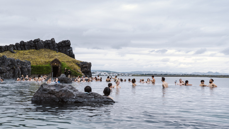 People bathing in the geothermal Sky Lagoon in Iceland