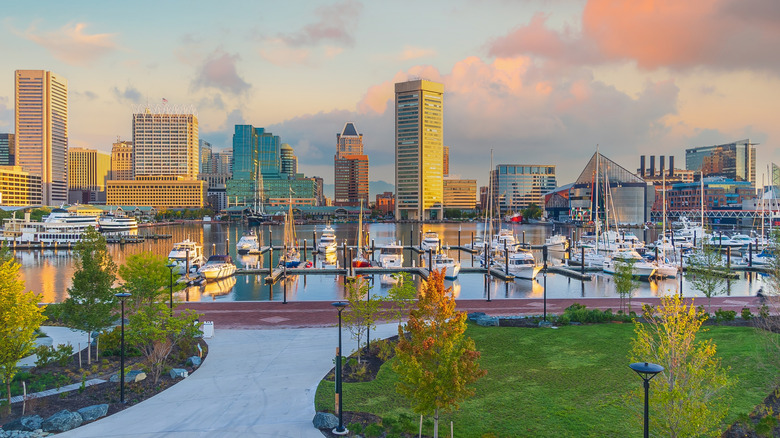 View of Inner Harbor marina illuminated by warm morning light in downtown Baltimore, Maryland