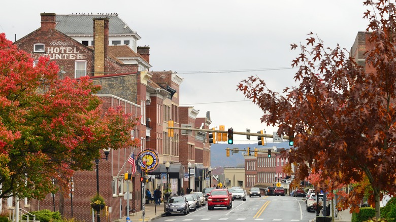 Rows of brick buildings and fall trees in Frostburg, Maryland