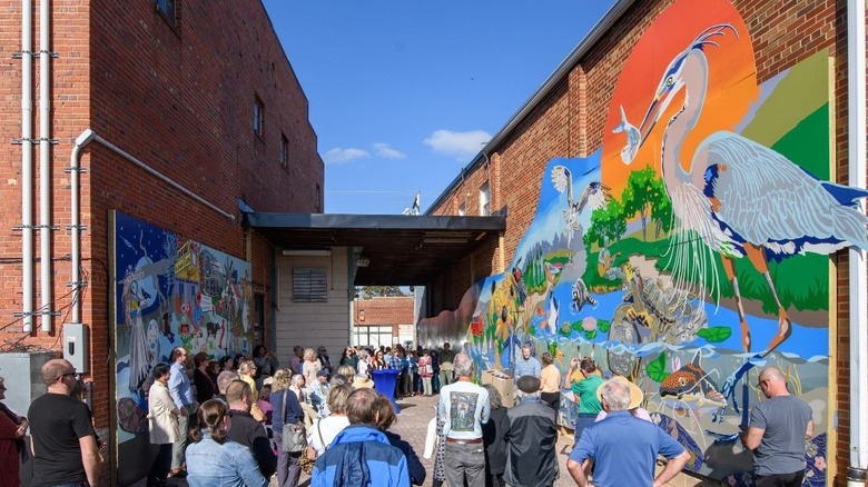 Crowd admires two murals in Leonardtown, Maryland