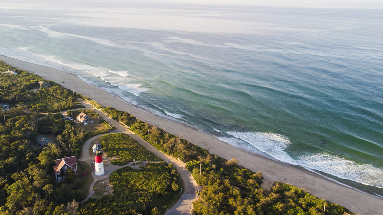 Aerial view of coastal Massachusetts lighthouse and ocean