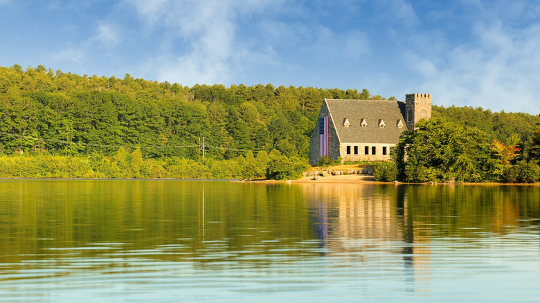 The Old Stone Church stands above Wachusett Reservoir on a sunny day in Massachusetts