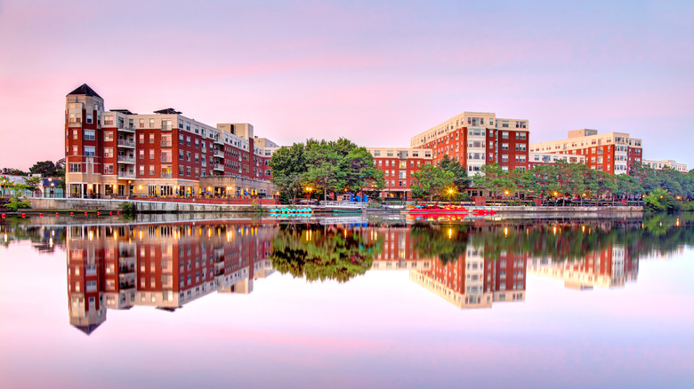 The city of Waltham, Massachusetts, reflecting in the water