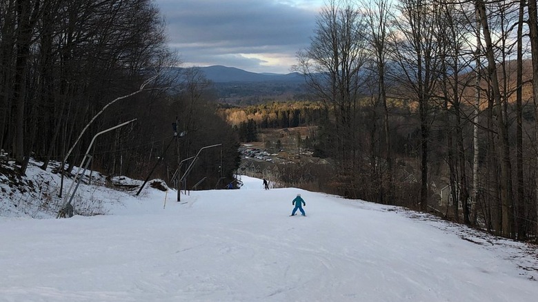 Guest skis down trail at Bousquet Mountain