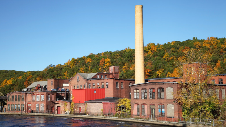 Old mill at Turners Falls with fall foliage