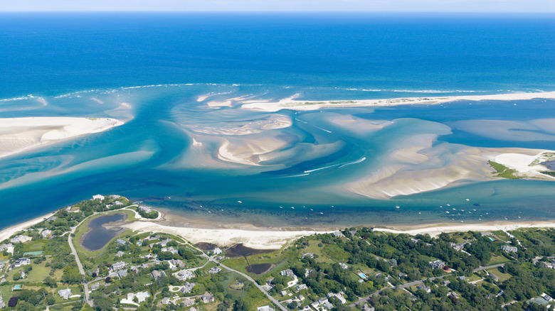 The Atlantic Ocean washing against the town of Chatham in the Lower Cape creating white shoals