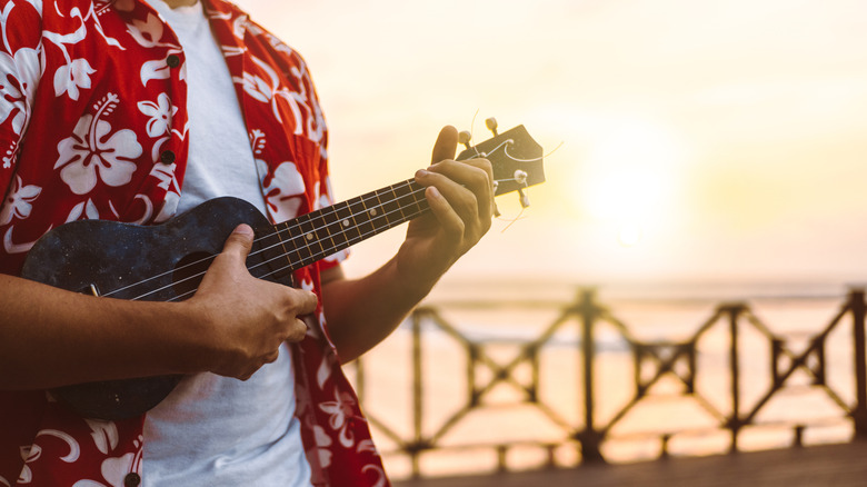 Person playing ukulele in Hawaii