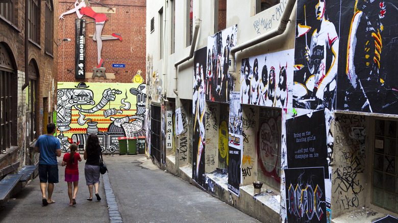 A family walking down AC/DC Lane in Melbourne