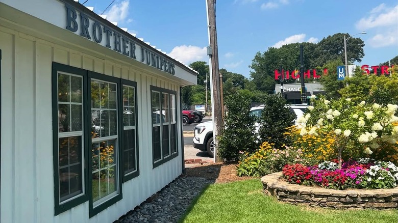A view of Brother Juniper's diner, with a flower garden