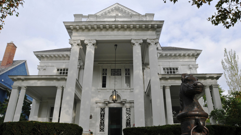 A beautiful white mansion with Ionic columns