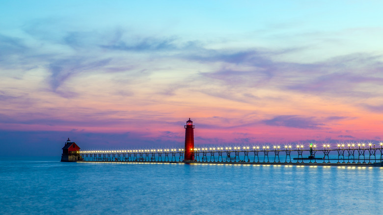 The Grand Haven South Pier's inner and outer lights at sunset on Lake Michigan