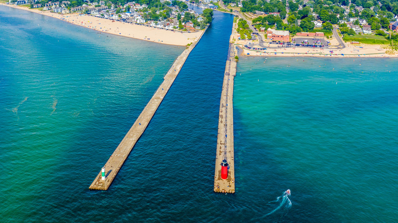 Aerial view of the South Haven Lighthouse and pier on Lake Michigan in Michigan, surrounded by turquoise waters