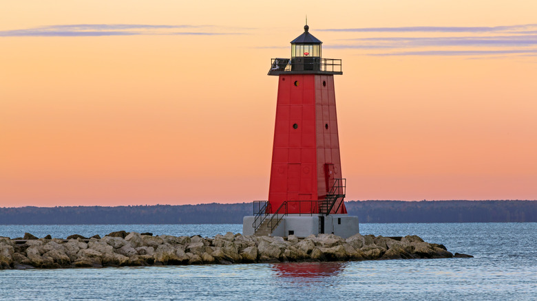 A red lighthouse on the coast of Lake Michigan in Manistique, on Michigan's Upper Peninsula