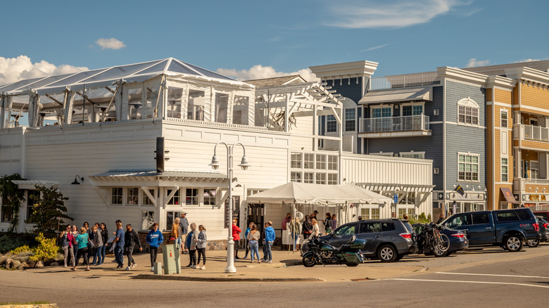 People hang out at a restaurant in the downtown area of New Buffalo, Michigan