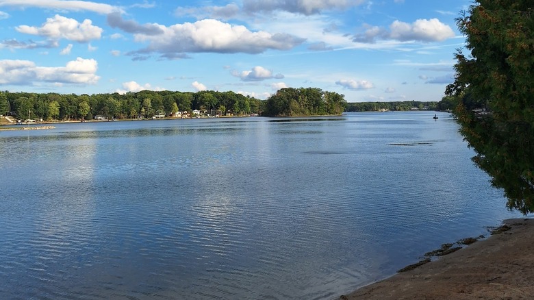 A lake in Wilson State Park with a line of trees on the shore in the background