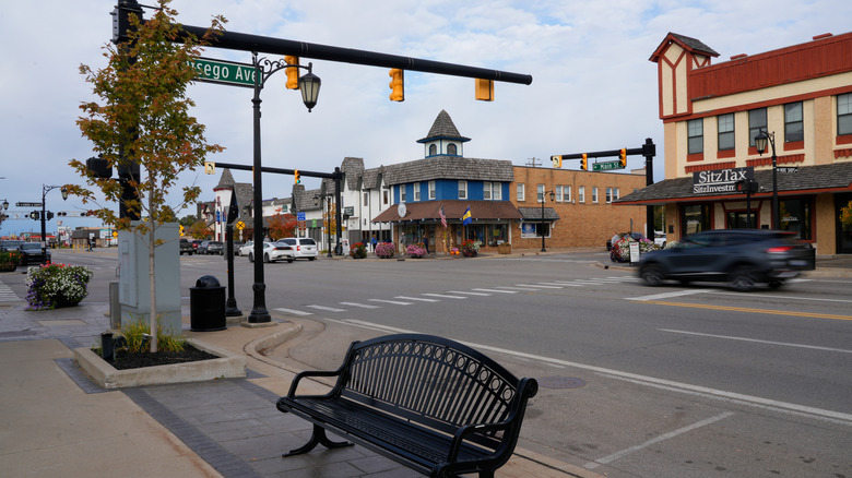 bench and cars driving down street in Gaylord, Michigan