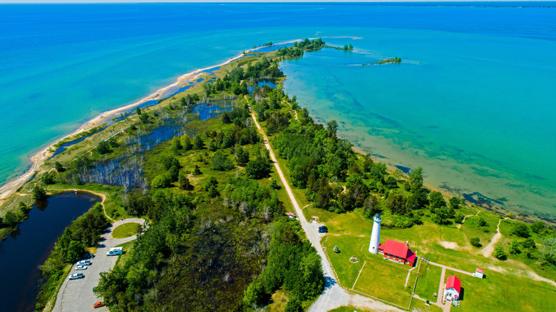 An aerial view of the beaches and Tawas Point Lighthouse in Tawas Point State Park, Michigan